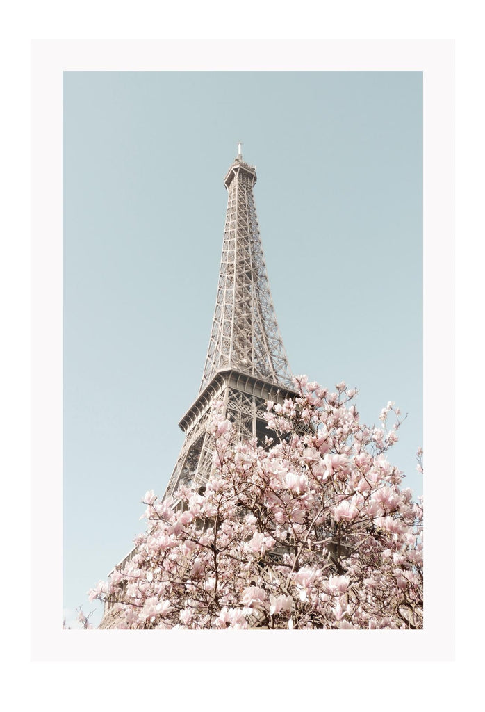 Eiffel tower Paris print with pink cherry blossoms and blue sky, pastel colours and dynamic view 