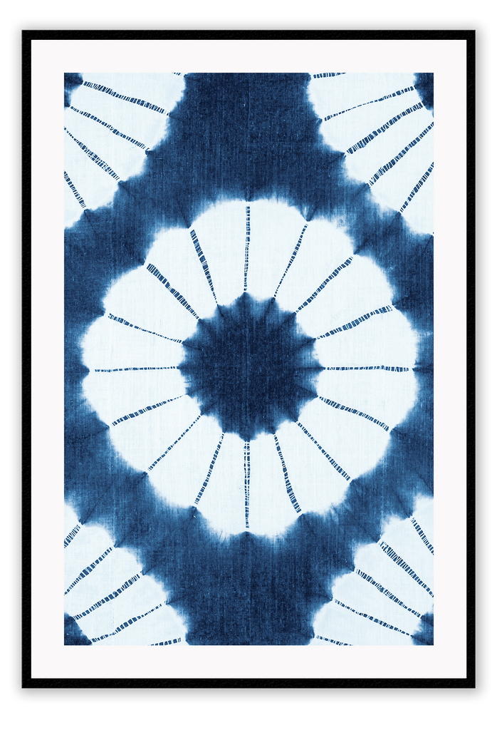 Tie dye print with blue and white detail forming symmetrical pattern with coastal ocean style. 