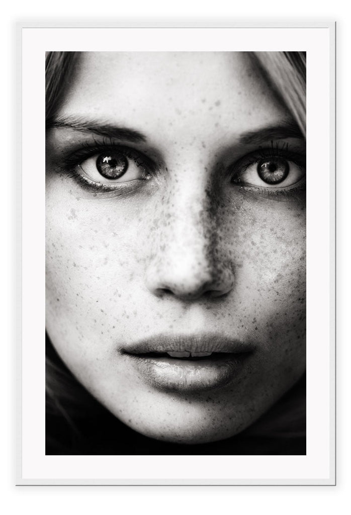 Close up photography print black and white freckles mondel with light eyes and striking features 