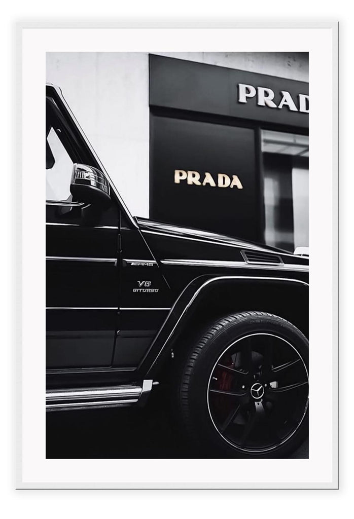 Fashion black and white photography print of a black Mercedes G Wagon in front of a Prada store.